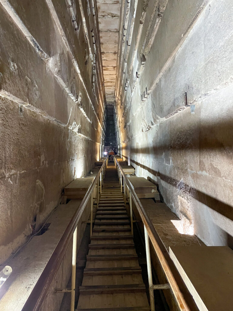 a long steep walkway in the grand gallery of khufu's pyramid
