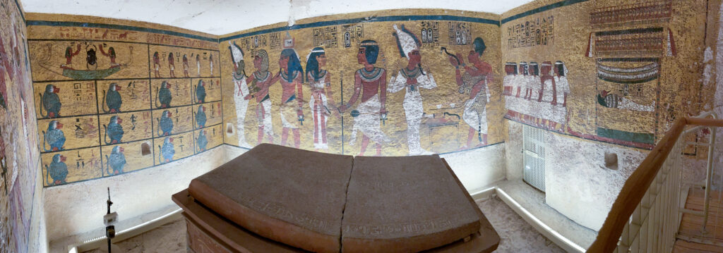 hieroglyphics and images line the walls around king tut's sarcophagus